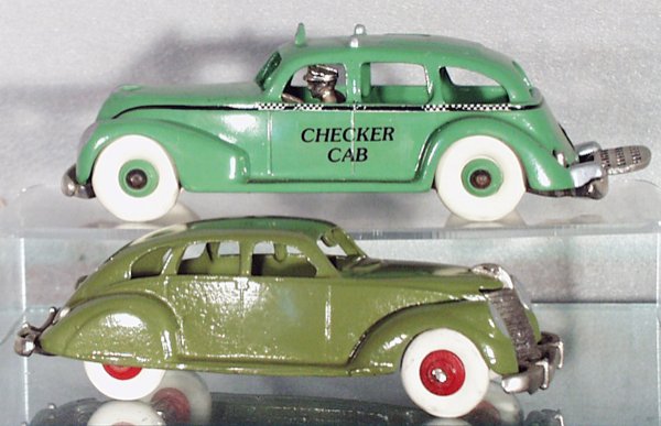 2 THOMAS TOYS AUTOS: painted cast iron, Checker Cab, nickel grille, driver & fold-down luggage rack, white rubber tires, checked stripe worn, 7 1/2 in long; Sedan, nickel grille & bumpers, white rubber tires, 7 in long, C