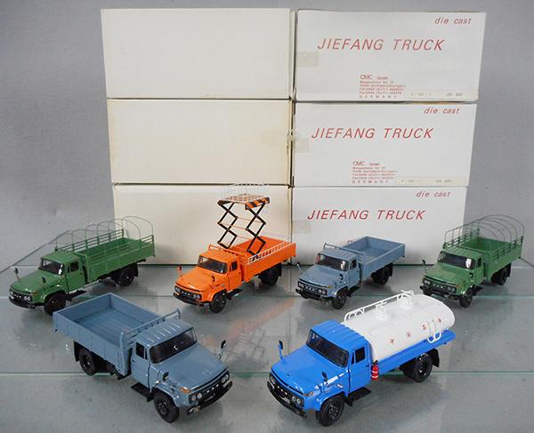 6 CMC JIEFANG TRUCKS: 2 Stake Trucks, green, 2 Pick Up Trucks, gray, Highway Maintenance Truck, orange, Tank Truck, blue & white, orig boxes minor wear, C8-9.