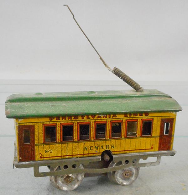 IVES 801 NEWARK TROLLEY: O ga, litho tin, gray frame, green roof w/spring pole, missing roller, windup working, made w/51 Newark car body, chassis bottom is Ives gray & black diamond pattern, ca 1910, C6-7.
