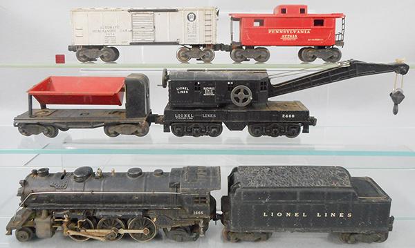 LIONEL TRAIN SET: O ga, 1666 loco, 2466T tender, 3454 merchandise car, 2460 crane, 3559 dump, 2472 caboose, 2 flying shoe trucks are incomplete, C5-6.