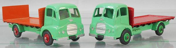 2 DINKY GUY WARRIOR TRUCKS: 432 Flat w/tailboard, w/windows & 513 tailboard held on by screw & nut, green & orange w/red hubs, 432 Flat Truck, green & red, C7-8.