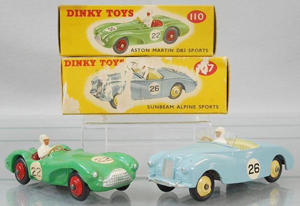 2 DINKY AUTOS: 110 Aston Martin, green w/red hubs, number rondels worn, orig box minor wear, has incorrect color dot, 107 Sunbeam Alpine, blue w/yellow hubs, orig box minor wear, has correct color dot, C7-8.