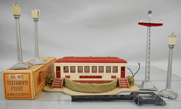 LIONEL ACCESSORIES: O ga, 3 #35 Boulevard Lamp Post, 1 has cracked lens & broken finial, 85 telegraph post, orig box missing 1 end flap, 442 Landscaped Diner, missing label on bottom, C5-7.