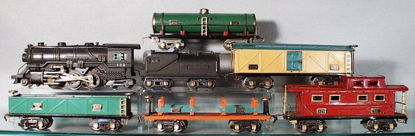 AF TRAIN SET: O ga, 425 loco, 426 tender, rubberstamping worn on 1 side, 3210 tank, 3208 box car, 3207 gondola, 3206 lumber flat, 3211 caboose, C5-6.