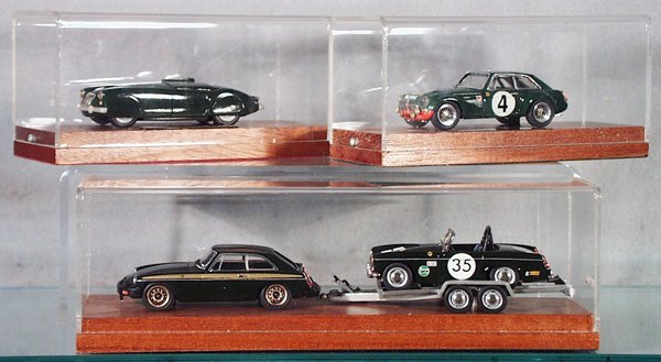 4 RAE MODELS MG AUTOS: MG EX175, green; MGC GTS, green; MG w/Trailer carrying Midget Racer, green, all in plexiglass cases, C9.