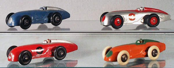 4 DINKY 23A MAGIC MIDGETS: 3 are English issue, the orange & green model is French, restored, C5-9.