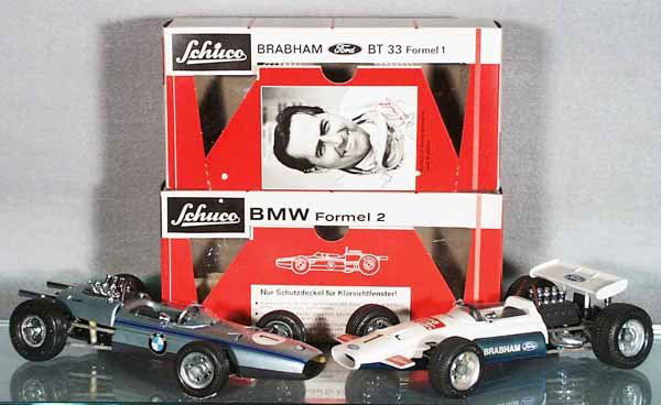 2 SCHUCO FORMULA 1 RACERS: 1072 BMW, 1075 Brabham Ford, windups working, both roll bars have oxidation spots, orig boxes, C8.