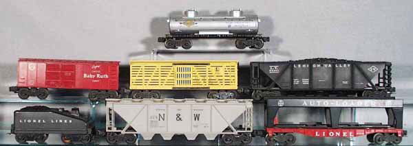 7 LIONEL CARS: O ga, 2465 Sunoco Tank, 6014 Box Car, 6656 Stock, 6436 LV Hopper, 6446 N&W Hopper, metal, hold down clips missing, 6414 Autoloader, no cars, 1614T Tender, some axles & wheels have oxidation, C5-6.
