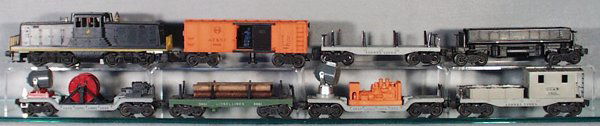 LIONEL TRAIN SET: O ga, 628 NP Switcher, end rails repainted, 3464 Box Car, 2411 Flat, 3469 Dump, 3650 Searchlight Generator, 3461 Lumber Dump, 3520 Searchlight, 6419 Work Caboose, C5-6.