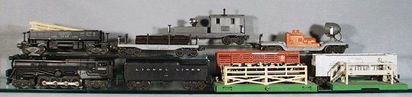 LIONEL TRAIN SET: O ga, 2020 Loco, 2046W Tender, 3656 Cattle, w/repainted stockyard, 3482 Milk Car, w/repainted platform, 3469 Dump, 2411 Flat, 1 step broken, 6520 Searchlight, 6420 Work Caboose, C5-6.