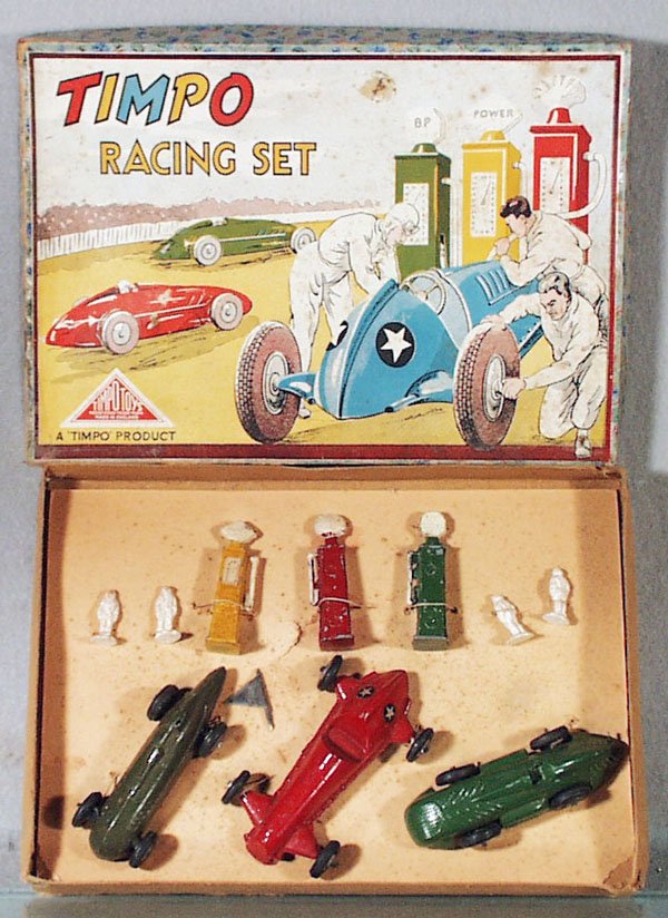 TIMPO RACING SET: die cast, 3 race cars w/4 drivers & 3 gas pumps, all tied to orig insert, some mildewing on accessories & box, orig box & insert very worn, C5-7.