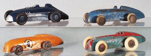 4 MG MAGIC MIDGETS: die cast, Timpo, 3 3/4 in long; slush, 3 3/4 in long; aluminum, 3 1/2 in long; Dinky 23A, 3 1/2 in long, all have worn paint & some worn rubber tires, C4.
