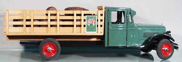 BUDDY L JR JACK DANIELS TRUCK: painted pressed steel & wood, 26 in long, customized w/electric headlights, wood truck bed & barrels, C8-9.