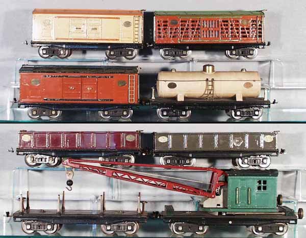 8 LIONEL FREIGHT CARS: std ga, 214 Box Car, roof repainted, 2 doors replaced; 213 Stock; 214 Box Car, 2 doors repainted; 215 Tank, restored & weathered; 2 #212 Gondolas, 1 has BB mark; 211 Lumber Flat, no load; 219 Crane, g