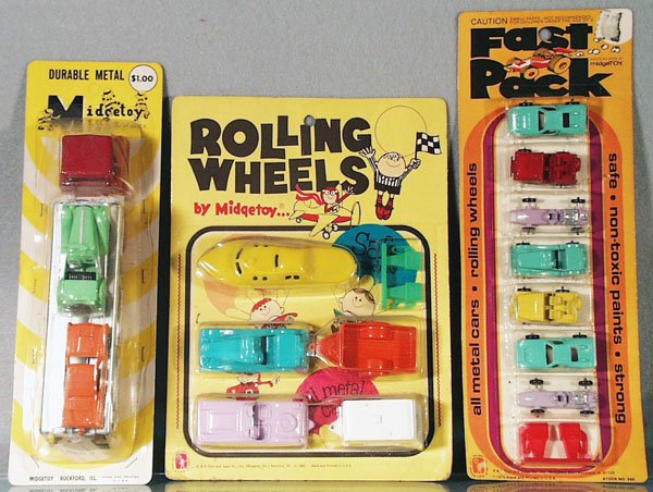 3 MIDGETOY CARDED SETS: Rolling Wheels from 1969; 550 Fast Pack, both of these are sealed on orig cards, cards have some wear, C10; Car Carrier & 2 Autos, orig card opened & window stapled back on to card, C8-9.