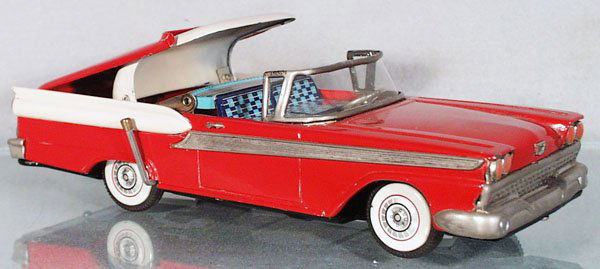 YACHIO 1959 FORD FAIRLANE: Japan, 2-door Convertible w/retractable roof, lithographed tin, friction working, red & white w/black rubber tires, 11 in long, there is a scratched area near where a driver's sideview mirror would be