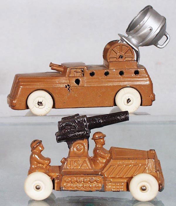 2 BARCLAY & MANOIL MILITARY VEHICLES: slush die cast, Barclay Searchlight Truck, white rubber tires, 4 in long, small die cast holes on 1 side; Manoil AA Gun Truck, white rubber tires, 3 1/2 in long, C6-7.