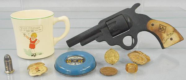 RADIO PREMIUM LOT: Radio Orphan Annie Ovaltine Mug, 1936 Badge w/secret compartment, Good Luck piece, Dick Tracy Badge, Lone Ranger Silver Bullet w/compass, Green Hornet Seal Ring, Tom Mix wooden Gun, Mystery Ring, Jack
