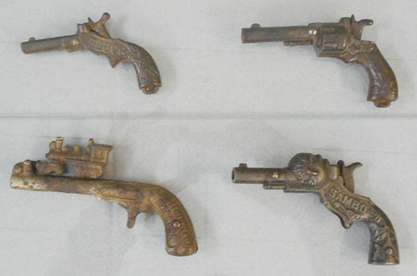 4 TOY CAP GUNS: Steven Pluck, 3 1/2 in, Stevens Snap, 4 in, Kenton Lightning Express, 5 in long, Ives Sambo, 4 3/8 in, finish worn on all, no cracks or breaks, working, C6-7.