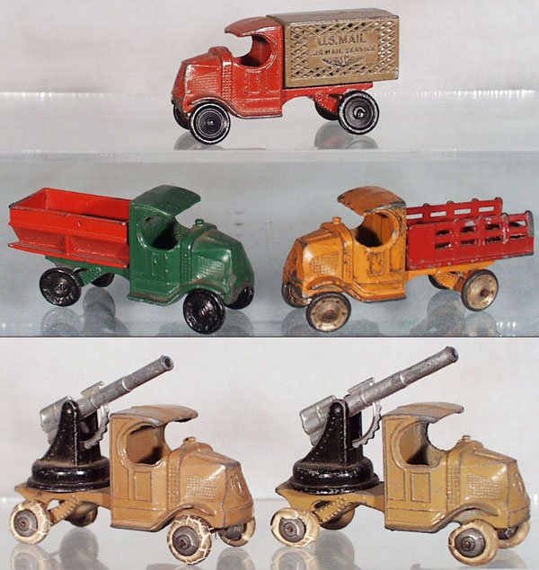 5 TOOTSIETOY MACK TRUCKS: 4655 US Mail Truck, 4639 Coal Truck, green & red, 4638 Stake Truck, orange & red, 2 #4643 AA Trucks, both have worn rubber tires, C4-5.