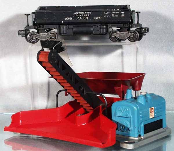 LIONEL 397 COAL LOADER W/CAR: O ga, 3469 operating dump car has paint chipping - mostly around the top edge of bin, C5-6.