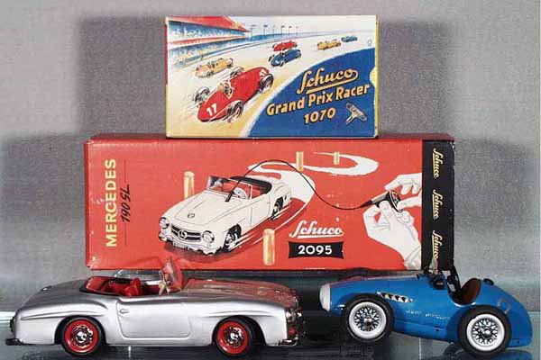 3 MODERN SCHUCO TOYS: 1070 Ferrari Racer, blue; 2095 Mercedes 190SL, silver; 1093 Cardboard Display, orig boxes, C8-9.
