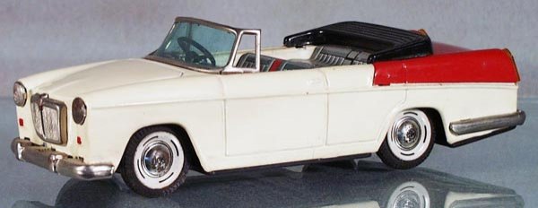 BANDAI CRAGSTAN MG MAGNETTE MARK II CONVERTIBLE: litho tin, friction working, cream & red, 8 1/2 in long, trim has tarnish, C7.