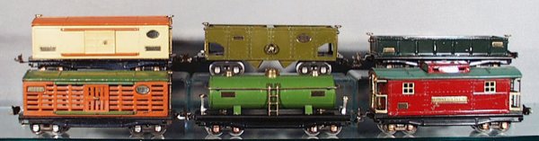 6 LIONEL FREIGHT CARS: O ga, 814 box car, yellow & orange; 816 hopper, repainted green, 812 gondola, repainted, 813 cattle car, orange & green, missing 1 brakewheel, some playwear & scratches, 815 tank, partially restored, 
