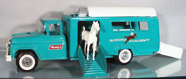 BUDDY L RIDING ACADEMY TRUCK: painted pressed steel & plastic, w/spring suspension, minor decal wear, clear dome has broken tabs, reverse side of truck has oxidation spots, C4-5.