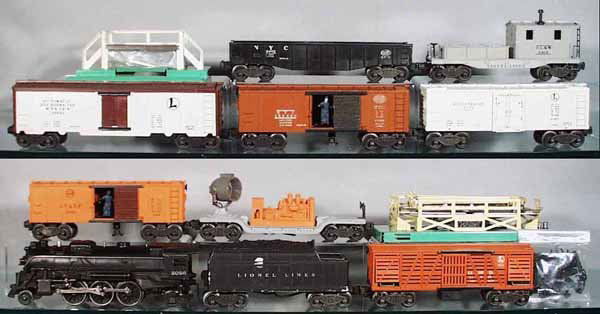LIONEL TRAIN SET: O ga, 2026 loco, missing 1 jewel, 6466WX tender, 1 side has serious scuffing down to the plastic, 3656 cattle car & pen, 6520 searchlight car, 3464 operating SF box car, 3662 milk car & platform, 3464