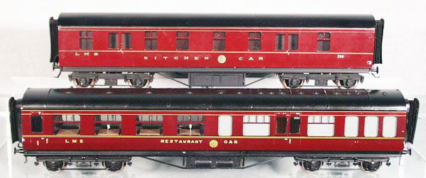 2 BASSETT-LOWKE LMS COACHES: O ga, litho & handpainted tin, w/interiors, 1 is a kitchen car, other is a restaurant car, both 16 in long, some paint rubs on high spots, C7-8.