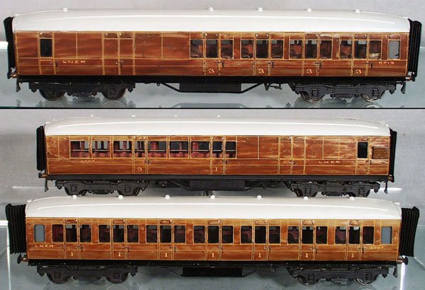 3 BASSETT-LOWKE LNER COACHES: O ga, litho & handpainted tin, w/interiors, 1 is a 3rd Class Coach, 2 are 3rd Class Combines, all are 16 in long, some small surface oxidation spots & small touch up spots on ends, C6.