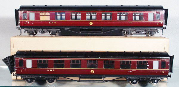 2 BASSETT-LOWKE LMS COACHES: O ga, litho & handpainted tin, 1st class corridor coach, 3rd class corridor coach, w/interiors, 3rd class has some paint chips on sides, each 16 in long, 1 orig box only, C7-8.