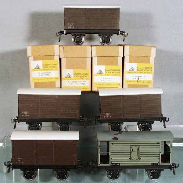 5 BASSETT-LOWKE FREIGHT CARS: O ga, 4 #1370/0 LMS covered vans, 3 orig boxes only, C9-10; 1364/0 TP Goods brake van, paint disturbances on roof, C9-10.