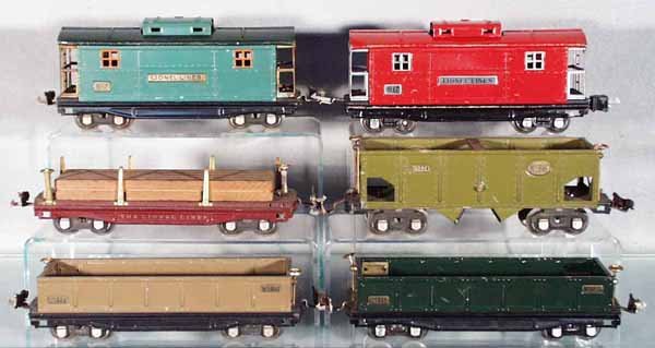 6 LIONEL FREIGHT CARS: O ga, 2 #817 cabooses, 1 has small oxidation area on handrail, other has a broken coupler, both have playwear & scratches; 811 lumber car w/load, missing 1 stake; 816, 2 #812 gondolas, all have some p