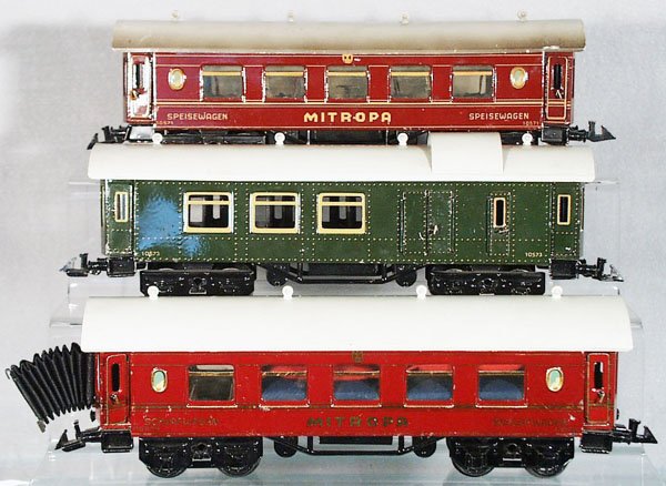 3 BING COACHES: O ga, handpainted tin, 10571 Mitropa spiesewagen, some paint chips & dent on roof, 10573 baggage, 10572 Mitropa schlafwagen, all w/full interiors, C7-8.