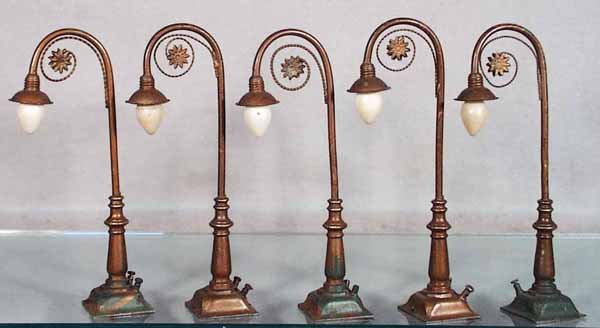 5 BING LAMP POSTS: handpainted tin w/die cast bases, 8 in tall, 3 bases have green layout paint, C6-7.