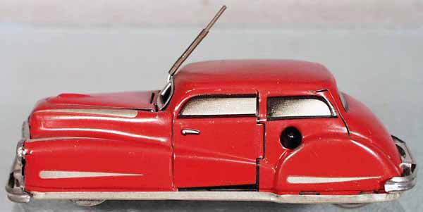 JOUSTRA 2002 AUTO: litho tin, clockwork working, 5 1/2 in long, when wound the door & hood open, C8.