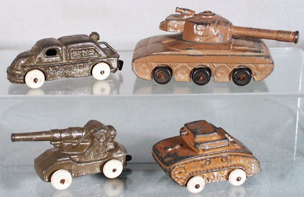 4 BARCLAY ARMY VEHICLES: slush die cast, Tractor, 3 in long, Tank, 3 3/4 in long, Howitzer, 2 1/2 in long, Tank, 2 1/2 in long, all have paint wear, C3-4.