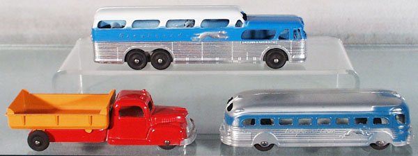 3 TOOTSIETOY VEHICLES: Greyhound Bus, closed chassis; Diamond T Dump Truck; Greyhound Bus, C8-9.