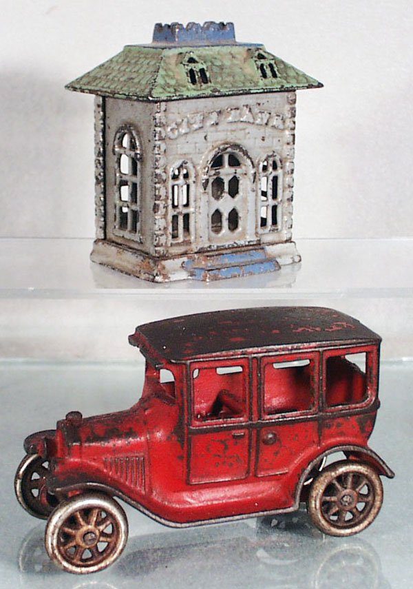 2 CAST IRON TOYS: painted cast iron, City still bank, 3 3/3 in tall, grey, green & blue; Arcade Model T Sedan, red, 4 3/4 in long, paint worn on roof, C4-5.