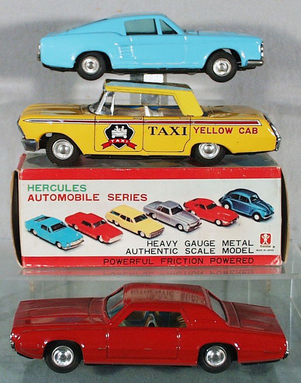 3 JAPANESE TOY AUTOS: litho tin, friction working, black rubber tires, Bandai 1967 Mustang, light blue, 7 in long, orig box minor wear; Takatoku 1962 Chevy Yellow Cab; Bandai 1968 Thunderbird, red, scratches on driver's si
