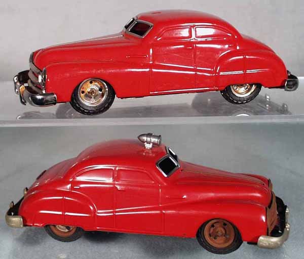 2 GAMA CHEVROLET AUTOS: litho tin, both red, 6 1/2 in long, friction working, 1 missing roof siren, other has surface oxidation on trim, C6-7.