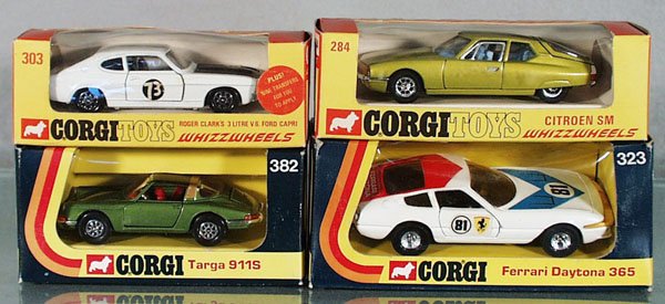 4 CORGI WHIZZWHEEL VEHICLES: 303 Ford Capri Race Car, some decal wear, orig box has price tag tear; 284 Citroen, orig box; 382 Porsche Targa, orig box; 323 Ferrari Daytona, orig box, C7-9.