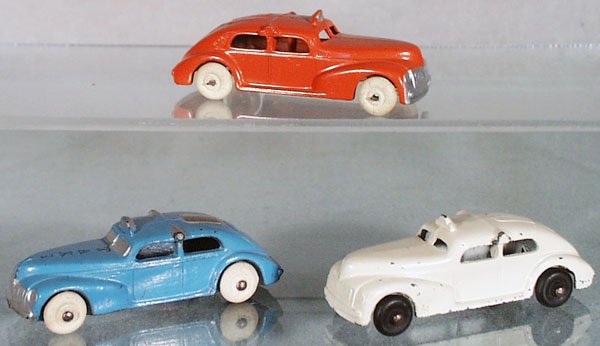 3 BARCLAY TAXIS: orange is die cast, blue is slush die cast, white is die cast, all are 3 1/2 in long, C5-7.