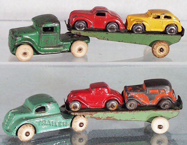 2 BARCLAY AUTO TRANSPORTS: die cast w/tin trailers, 5 in long, rubber tires worn, 1 tractor has a reglued trailer peg, C4-5.