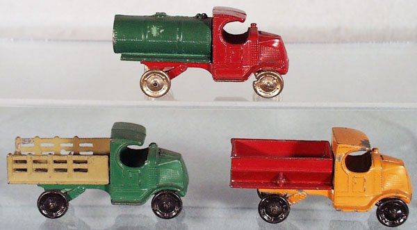 3 TOOTSIETOY MACK TRUCKS: 4640 Tank Truck, red & green, w/small dent, 4638 Stake Truck, green & tan, 4639 Coal Truck, orange & red, C5-6.