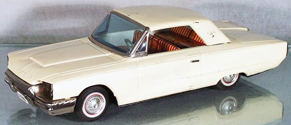 ASAHI 1964 FORD THUNDERBIRD: litho tin, friction working, black rubber tires, 12 1/4 in long, some playwear, C5-6.