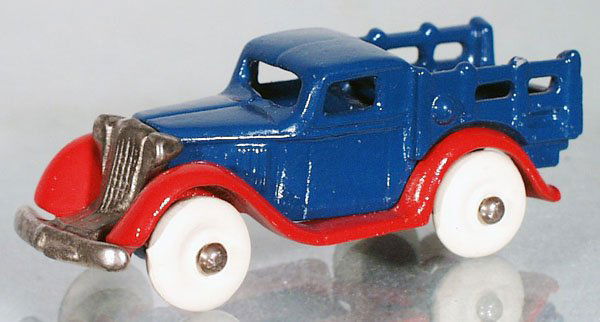 ARCADE CHEVROLET STAKE TRUCK: painted cast iron, blue & red, w/nickel grille, 4 in long, restored, C9.