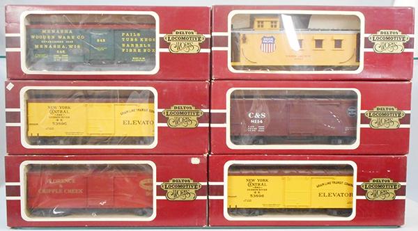 6 DELTON FREIGHT CARS: G ga, 4255 Menasha, 2 #4254 NYC, Florence & Cripple coach, 4275 UP caboose, 4254 Colorado & Southern, orig boxes minor wear, C7-8.